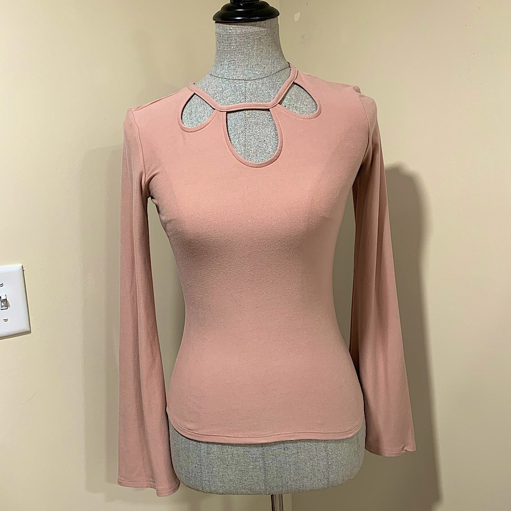 Form fitting bell sleeved top